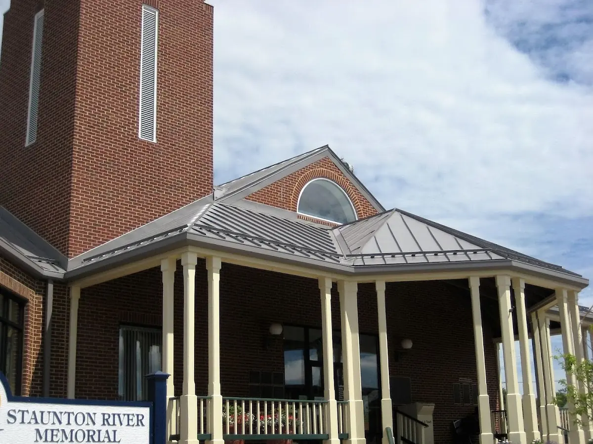 Skilled roofing craftsmen working on a residential roof in Shawsville